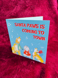 Funny festive dogs Christmas card - ‘Santa Paws is coming to town’